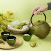 Théière ming 0,9L verte et dorée - Théière en fonte - Aromandise - utilisation